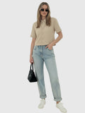 Clueless Paris beige cropped short sleeve button-down linen-blend shirt worn with light wash jeans and sunglasses