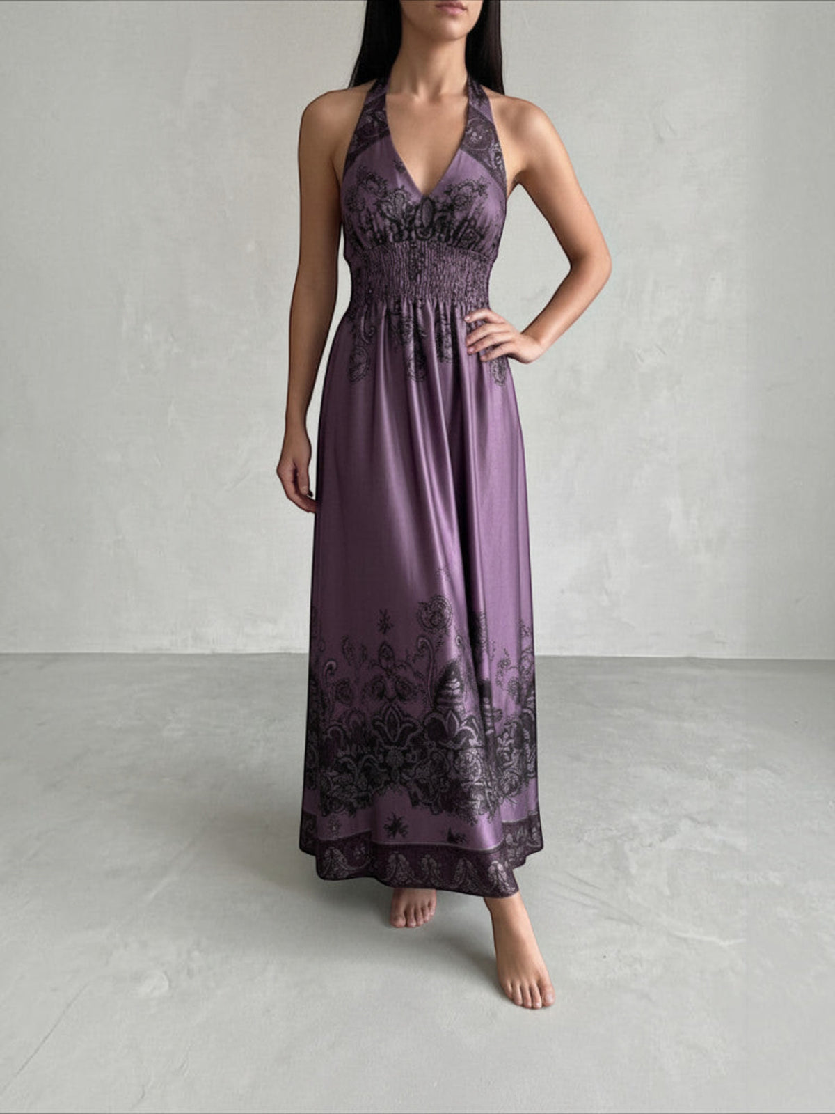 Clueless Paris deep purple satin maxi dress with black paisley print, plunging V-neck, and smocked waist.