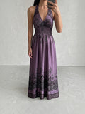 Clueless Paris long satin backless dress in deep purple with black paisley print, V-neck and smocked waist.
