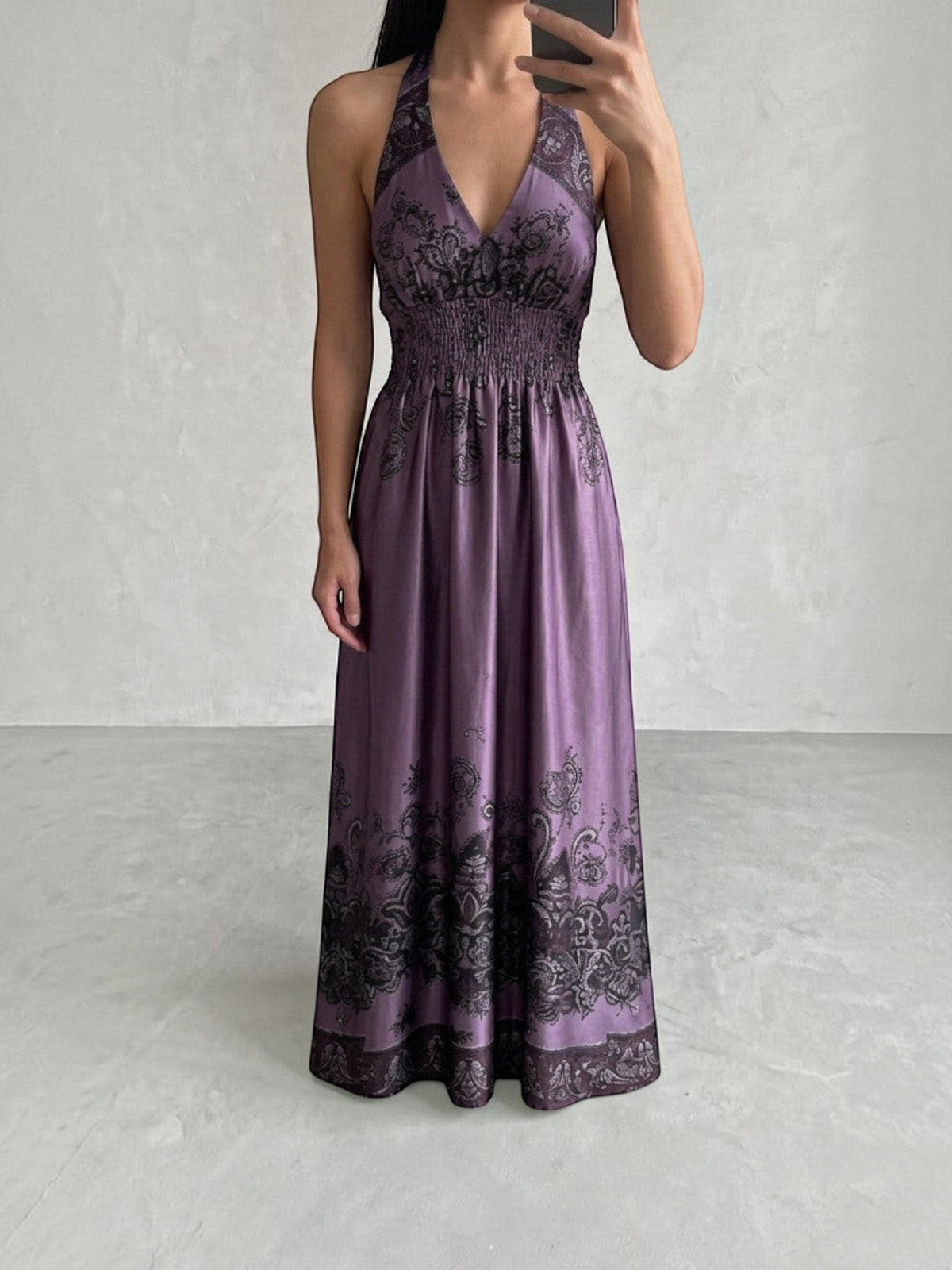 Clueless Paris long satin backless dress in deep purple with black paisley print, V-neck and smocked waist.