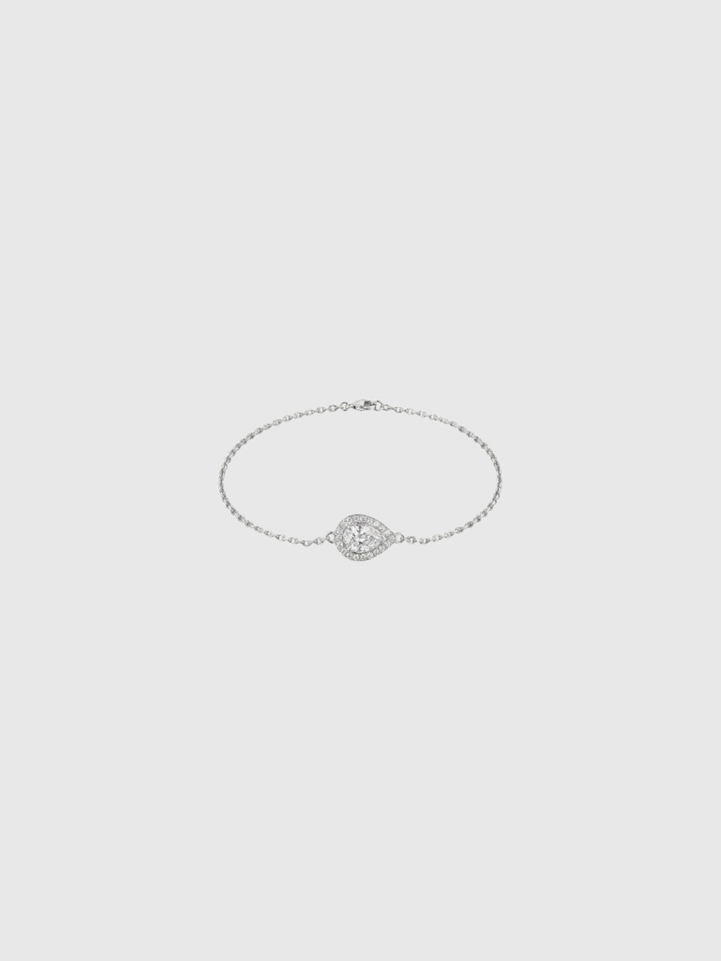 Clueless Paris silver chain bracelet featuring a teardrop-shaped cubic zirconia pendant with a halo setting.