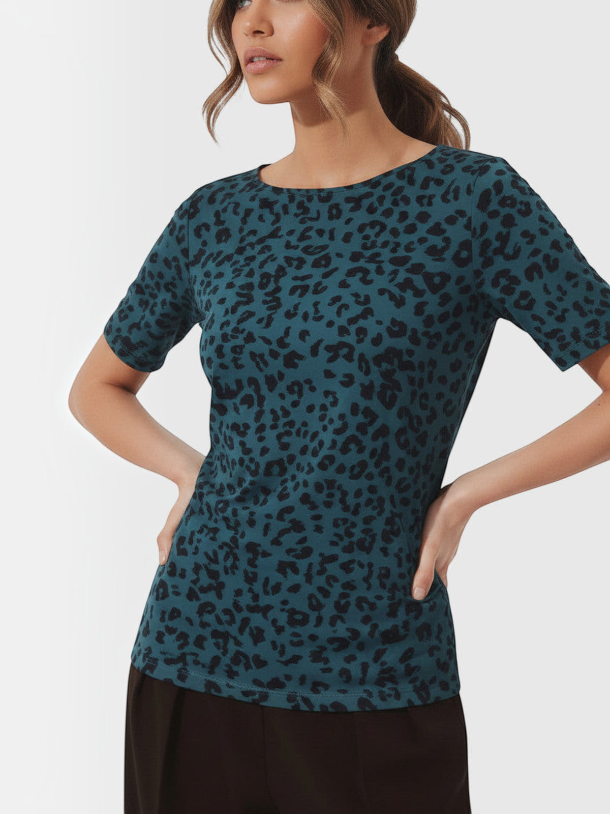 Clueless Paris teal leopard print t-shirt with a fluid fit worn by a model against a white background