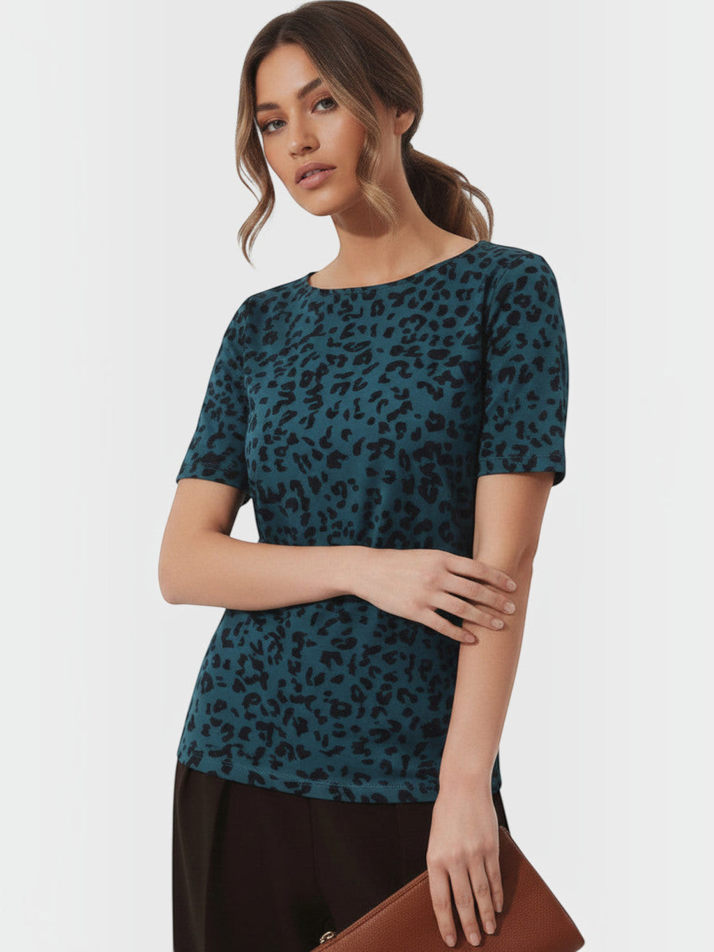 Clueless Paris teal leopard print t-shirt with a fluid fit, worn by a model against a neutral background.